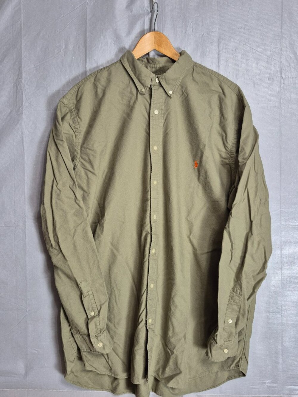 This Polo Ralph Lauren Button Down Shirt is a stylish and versatile addition to